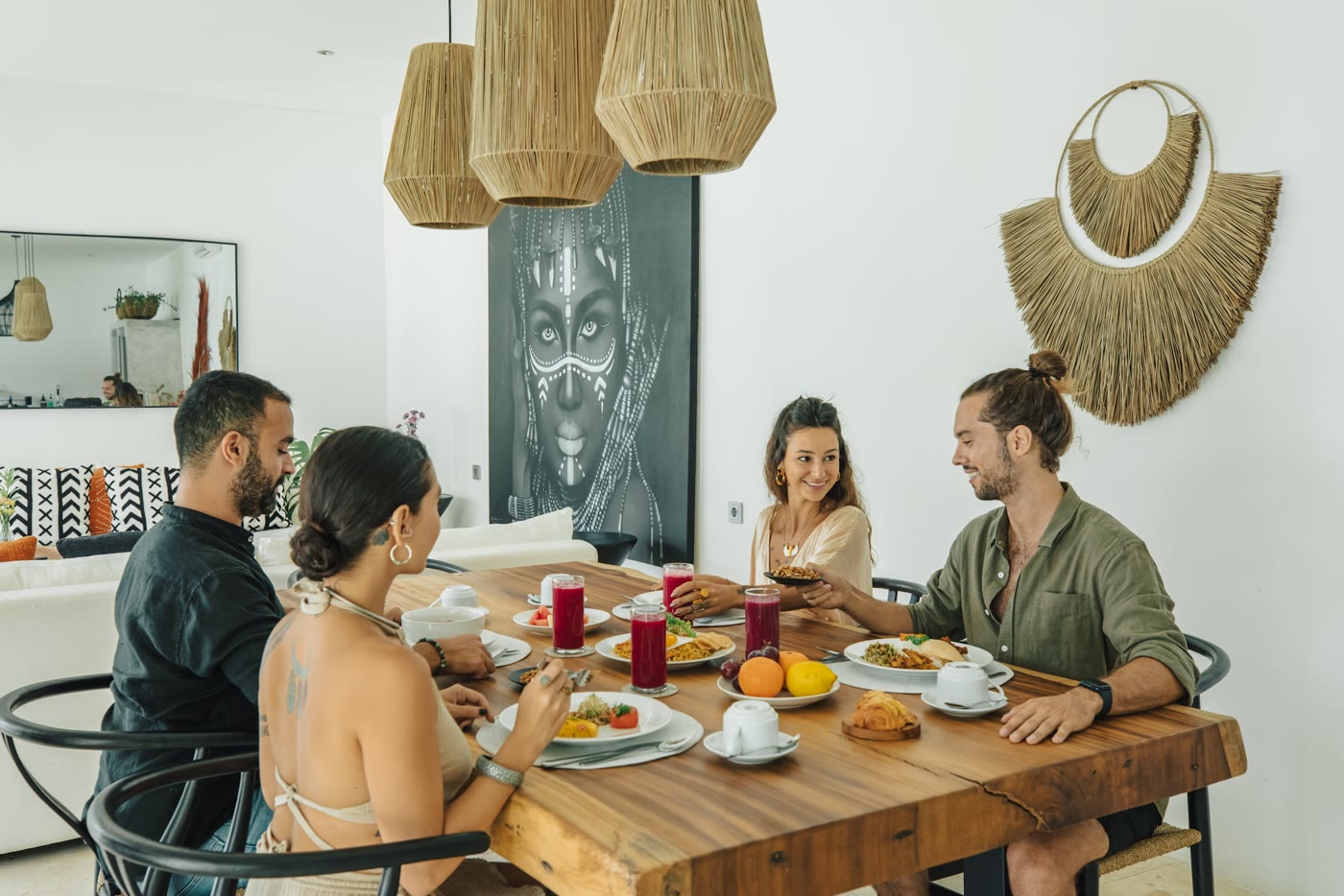 A family sharing a meal at the villa dining table